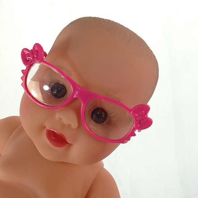 boy doll with glasses